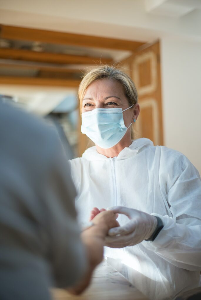 photo of nurse checking pulse of patient